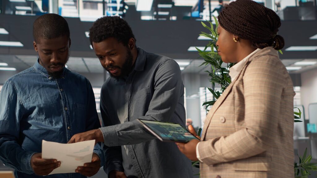 Professional Team Analyzing Archived Data Financial File Meeting 1024x576